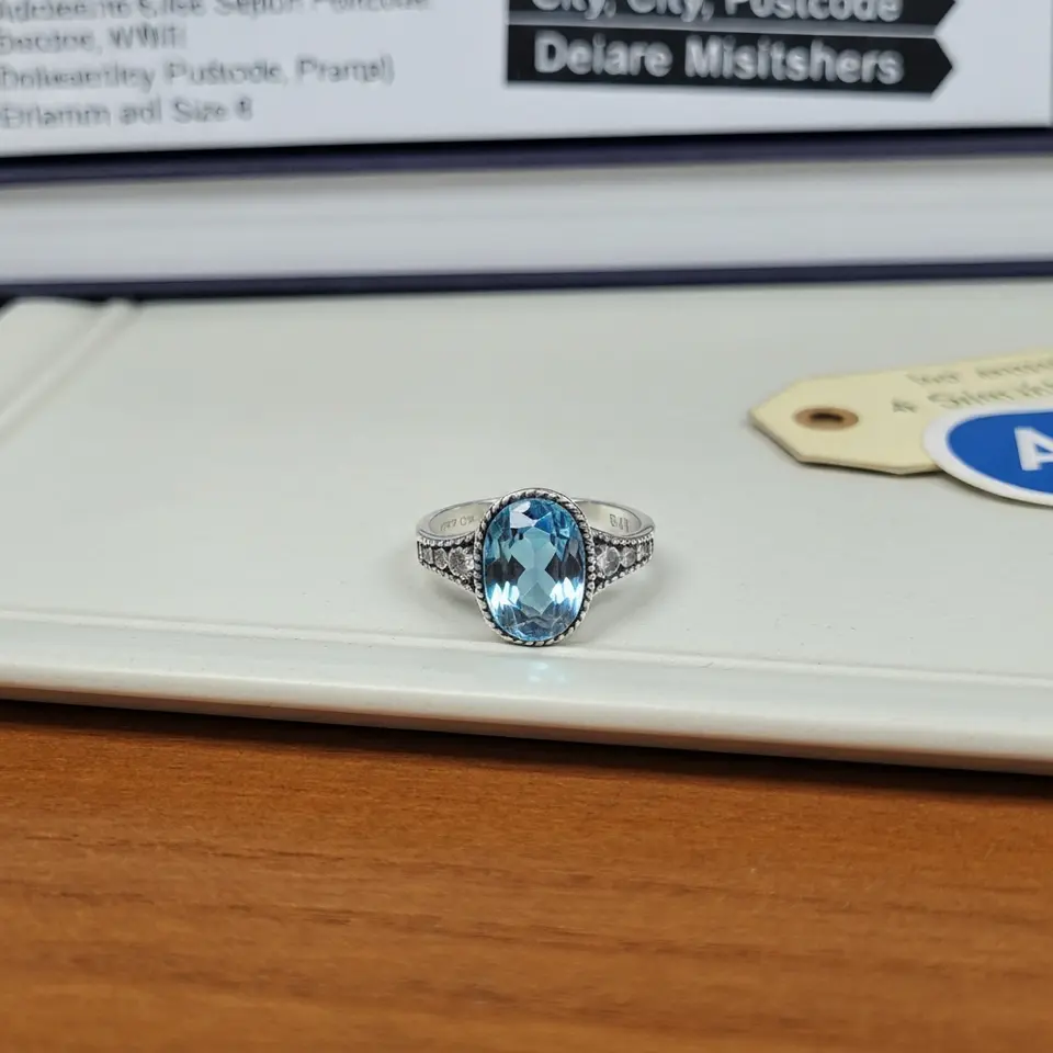 Sterling Silver and Blue Topaz Ring Size 8 - фото 1